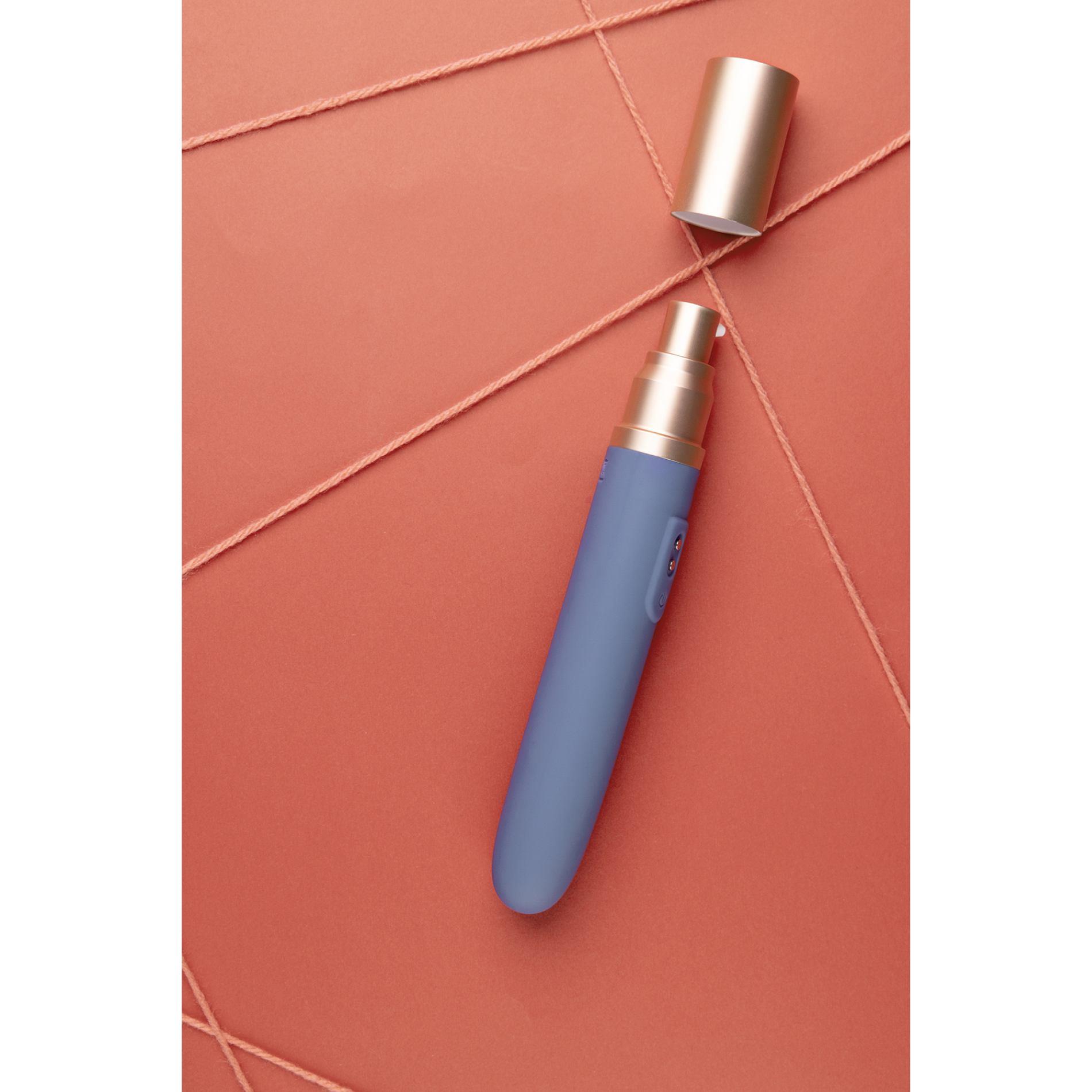 travel vibrator with lube compartment and pump