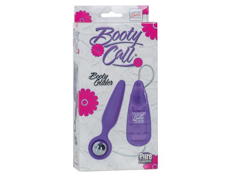 Wibrujący korek analny Booty Call Booty Glider fioletowy 9.5 cm